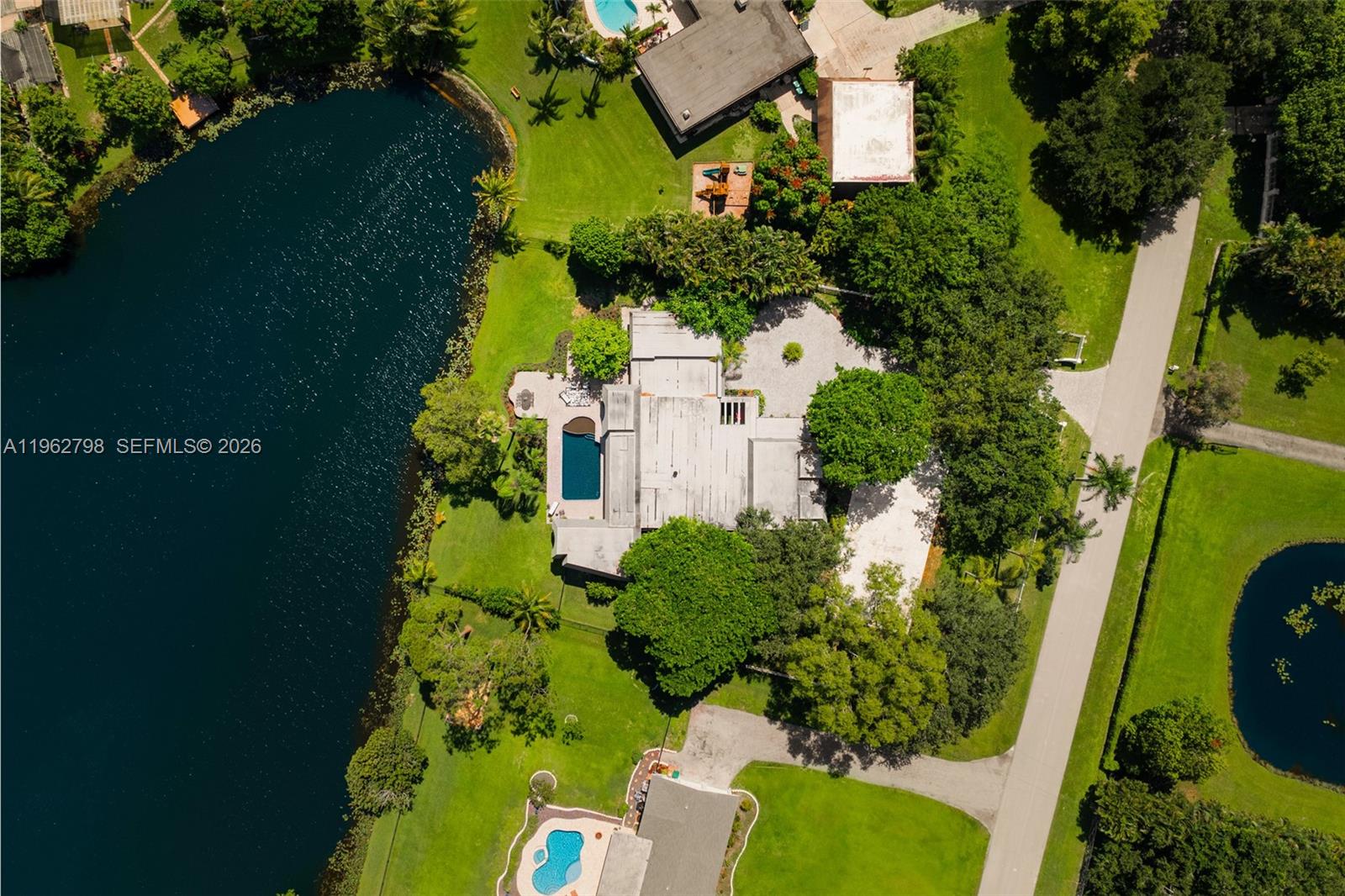 11000 Southwest 25th Street Davie, FL 33324 - Photo 42 of 45 an aerial view of residential house with outdoor space and trees all around