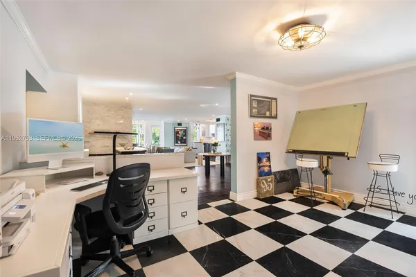 a kitchen with a checkered floor and white cabinets