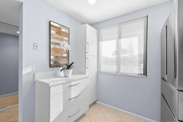 a kitchen with appliances a microwave and a counter space