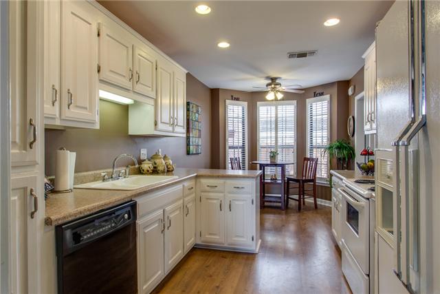 737 Gen George Patton Road, Unit 737 Nashville, TN 37221 - Photo 4 of 18 Cheery Kitchen with Upgraded Canned Lighting, Ceiling Fixtures as well as Over the Cabinet Accent Lighting