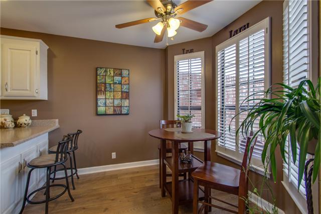 737 Gen George Patton Road, Unit 737 Nashville, TN 37221 - Photo 5 of 18 Counter Seating with Large Eat-in Kitchen that Overlooks the Private Back Patio through the Bay Window. Upgraded Plantation Shutters throughout the home.