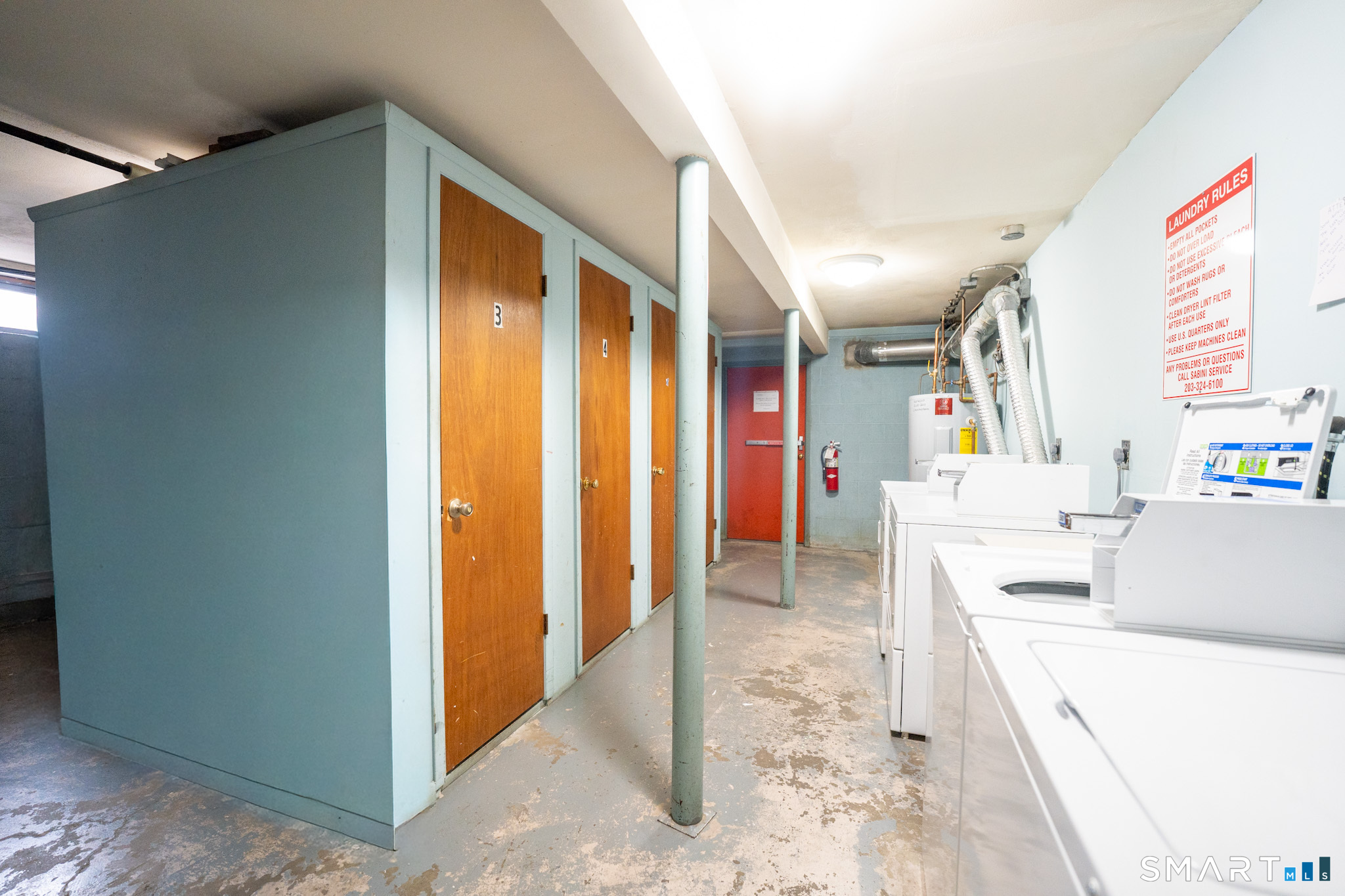24 Home Court, Unit 4 Stamford, CT 06902 - Photo 13 of 18 a view of hallway with furniture and a refrigerator