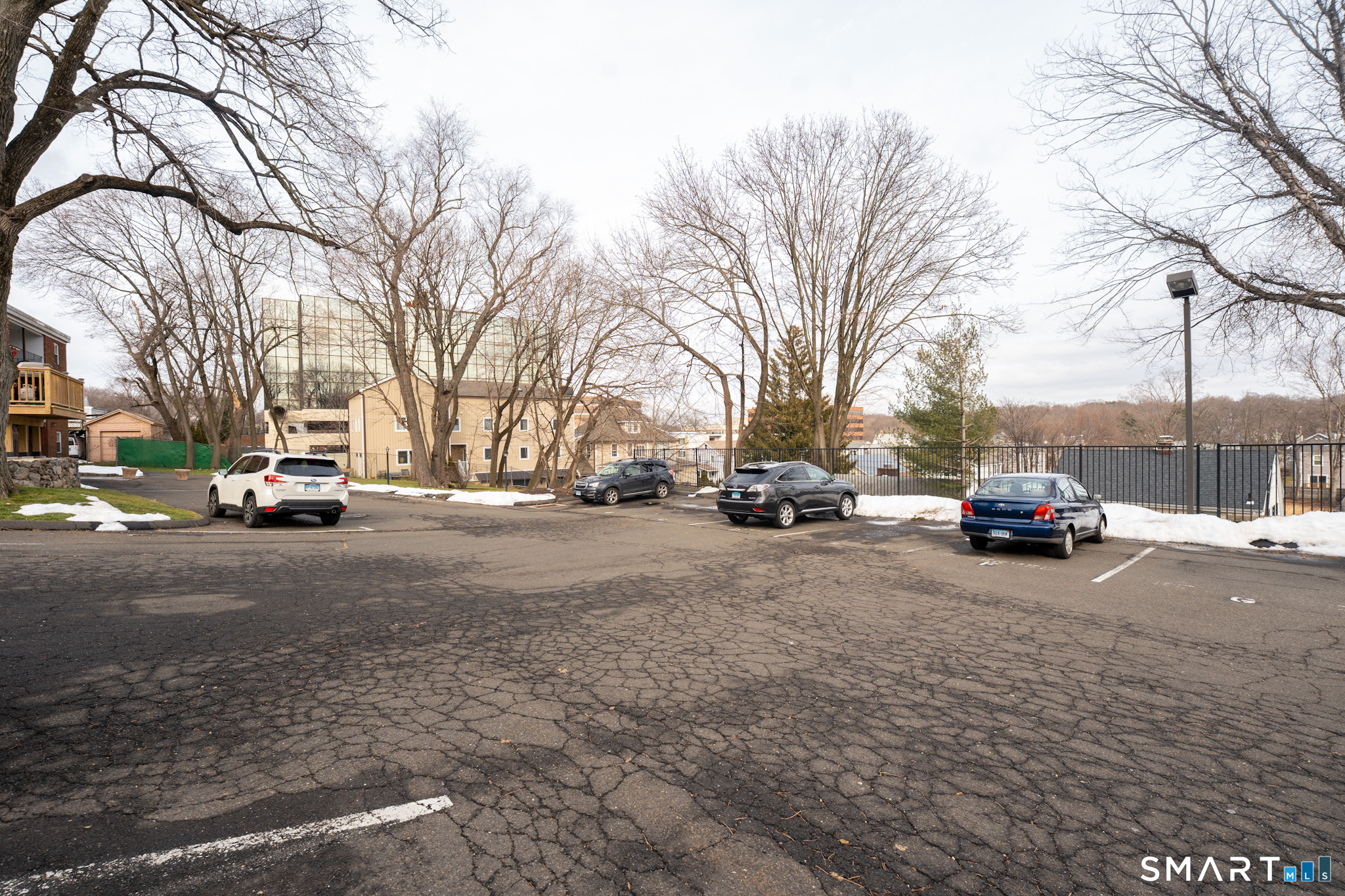 24 Home Court, Unit 4 Stamford, CT 06902 - Photo 17 of 18 a view of road with a large tree