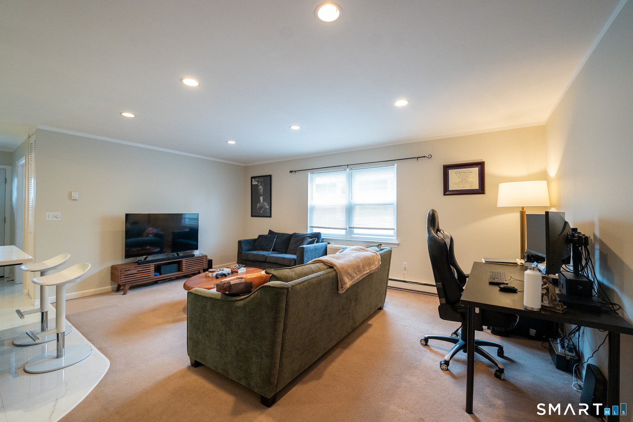 24 Home Court, Unit 4 Stamford, CT 06902 - Photo 6 of 18 a living room with furniture and a flat screen tv