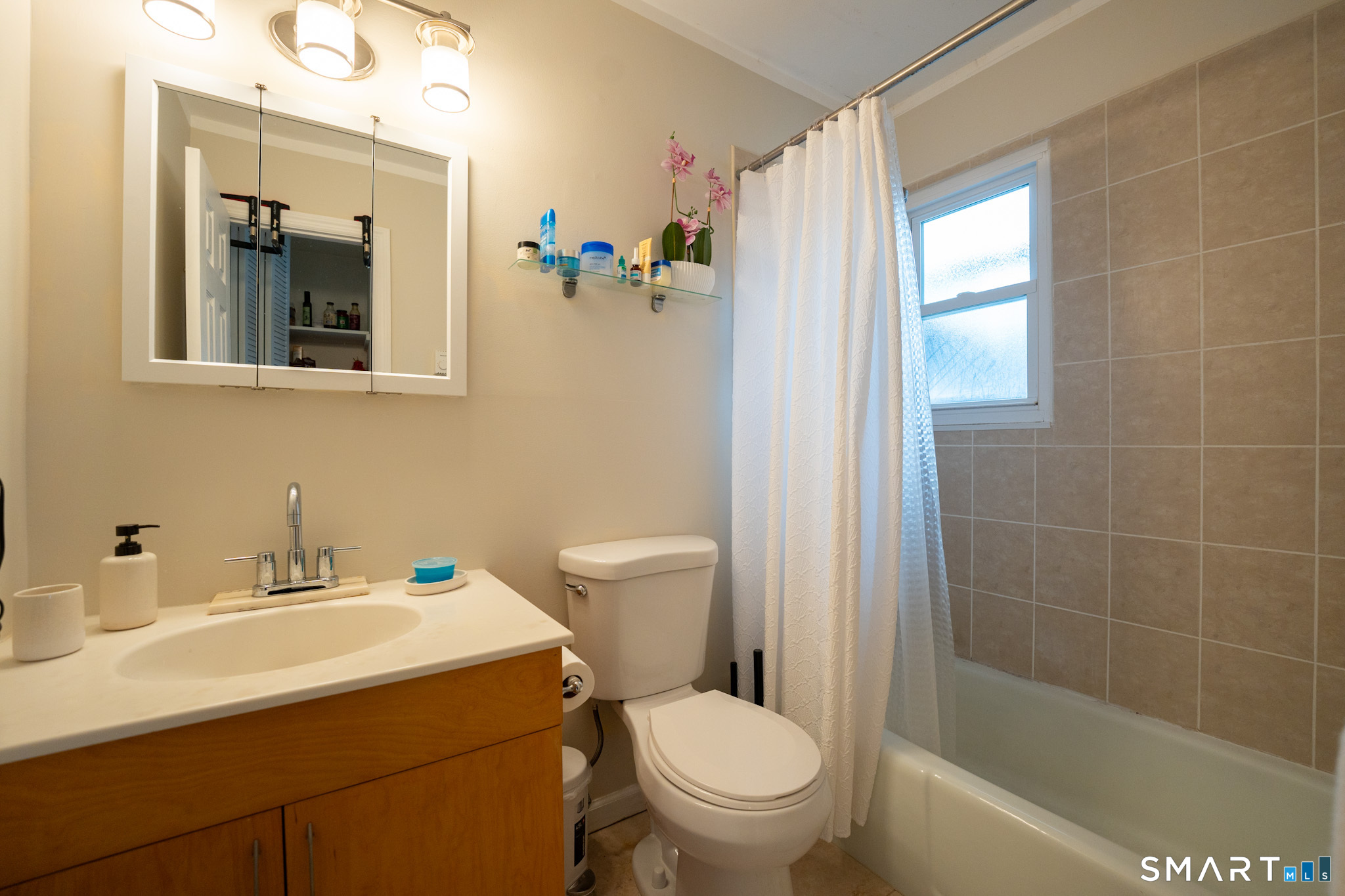 24 Home Court, Unit 4 Stamford, CT 06902 - Photo 9 of 18 a bathroom with a sink toilet and shower