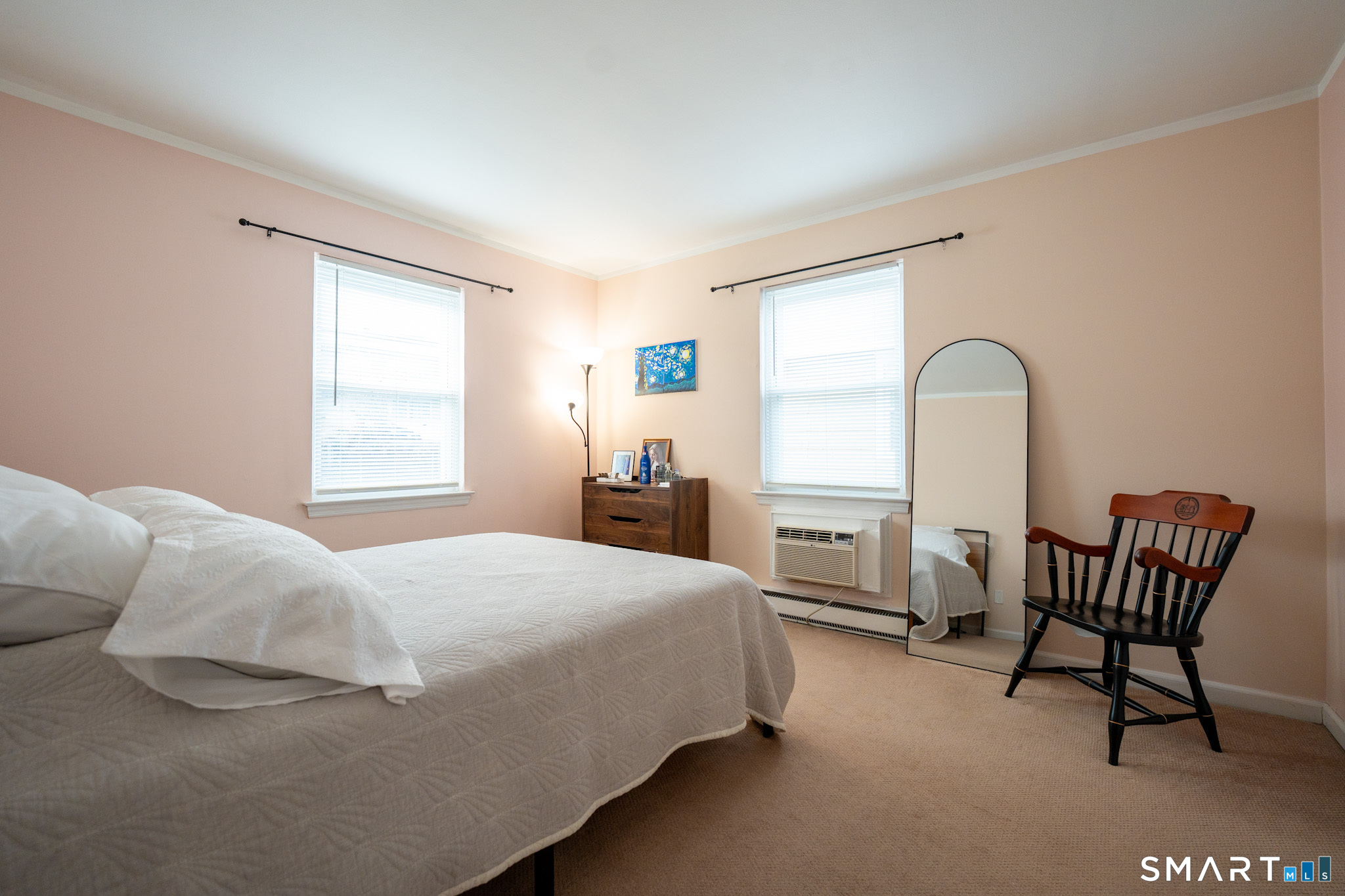 24 Home Court, Unit 4 Stamford, CT 06902 - Photo 10 of 18 a bedroom with a bed chair and window