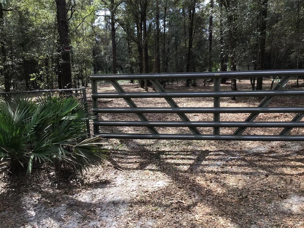 0 Southwest 153rd Lane Dunnellon, FL 34432 - Photo 9 of 10 a view of a yard with wooden fence