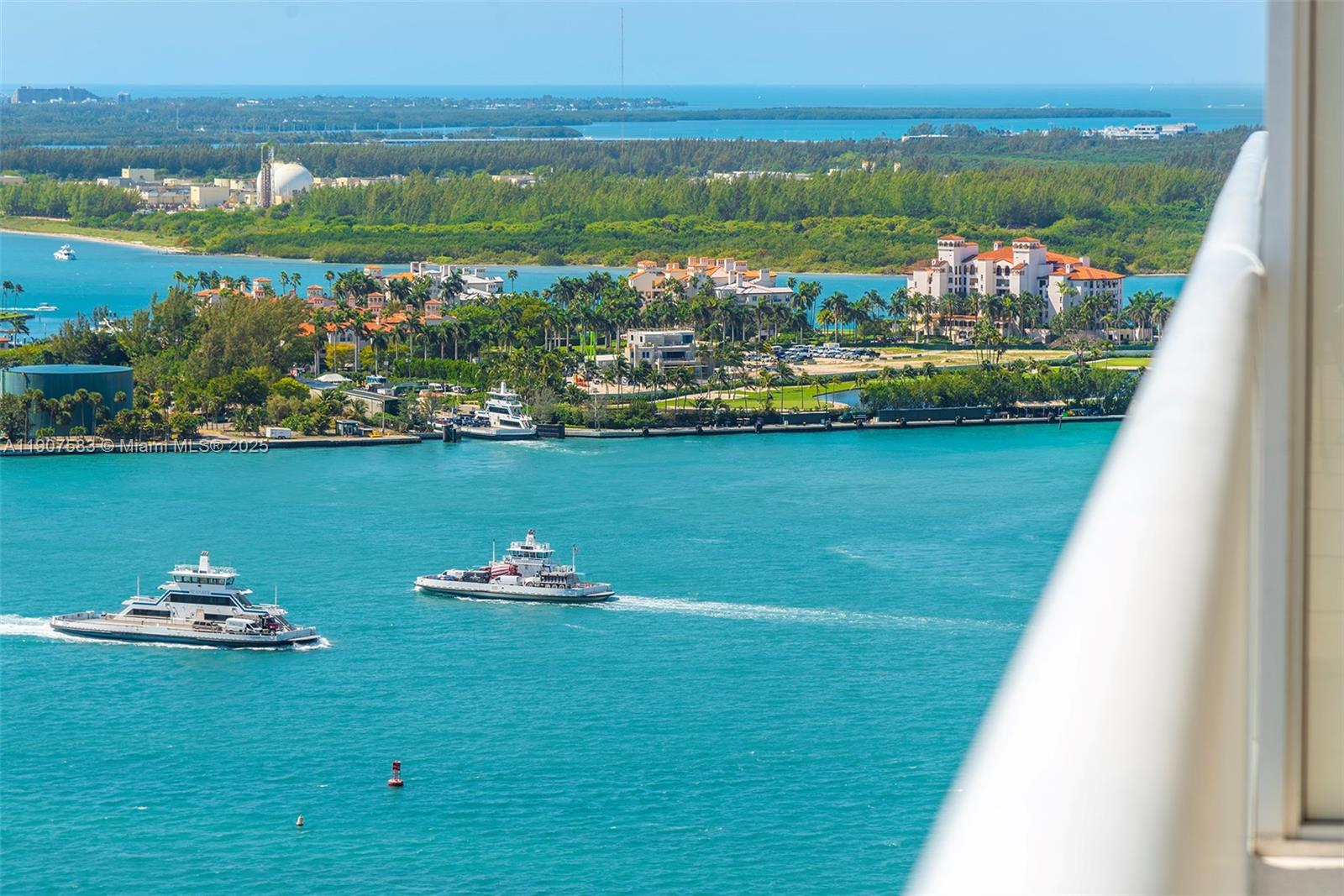 450 Alton Road, Unit 3010 Miami Beach, FL 33139 - Photo 2 of 62 a view of a lake with a large mountain