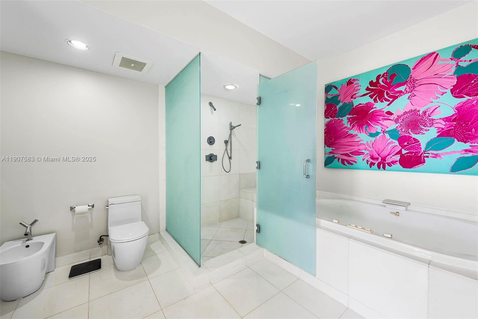 450 Alton Road, Unit 3010 Miami Beach, FL 33139 - Photo 22 of 62 a bathroom with a bath tub and shower