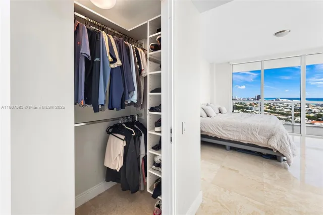 a bedroom with a bed and a table