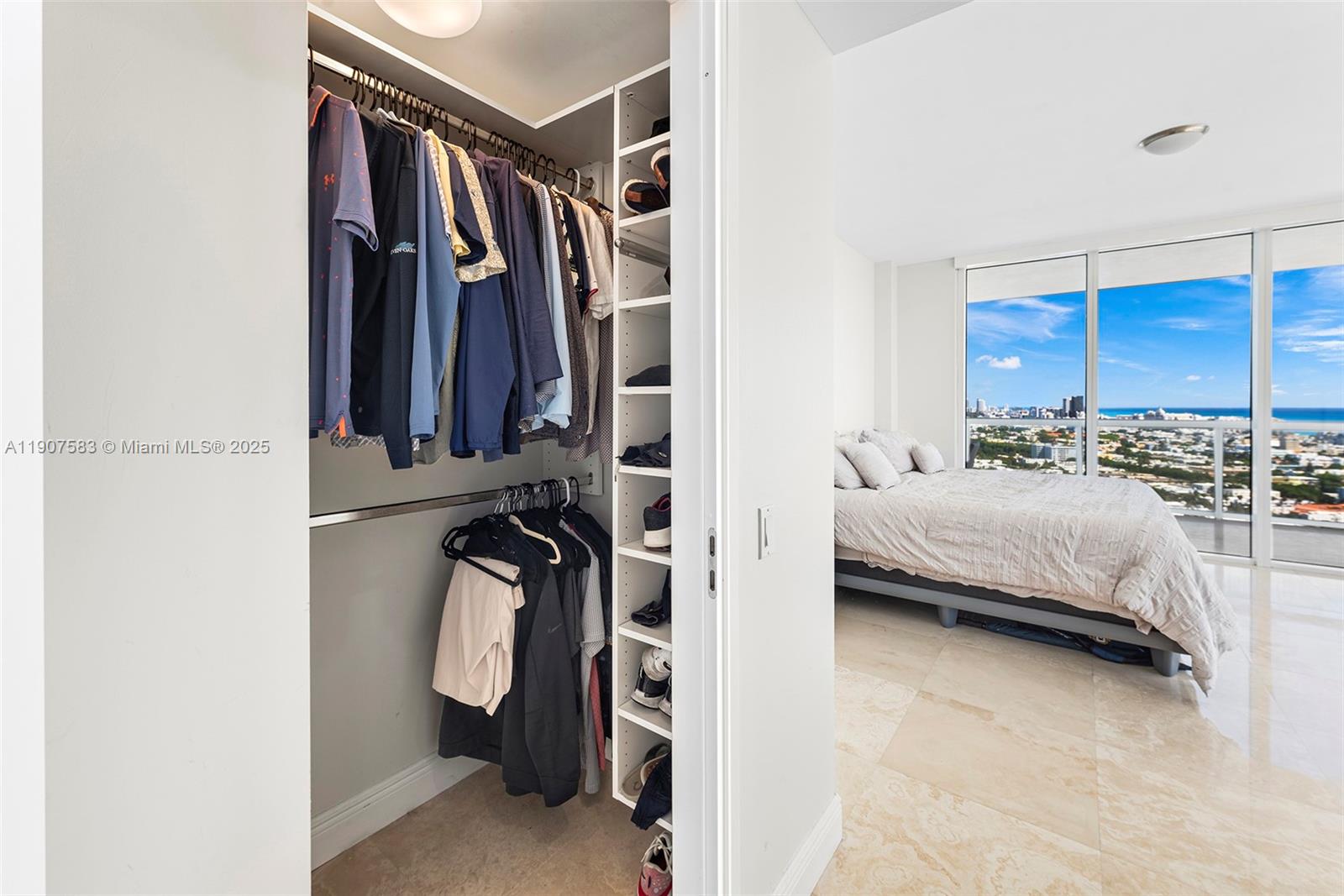 450 Alton Road, Unit 3010 Miami Beach, FL 33139 - Photo 24 of 62 a bedroom with a bed and a closet