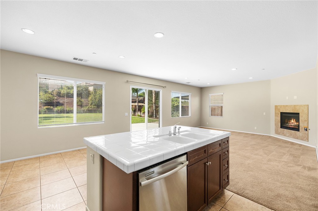 12047 Dewar Drive Riverside, CA 92505 - Photo 13 of 40 a view of kitchen with center island and windows