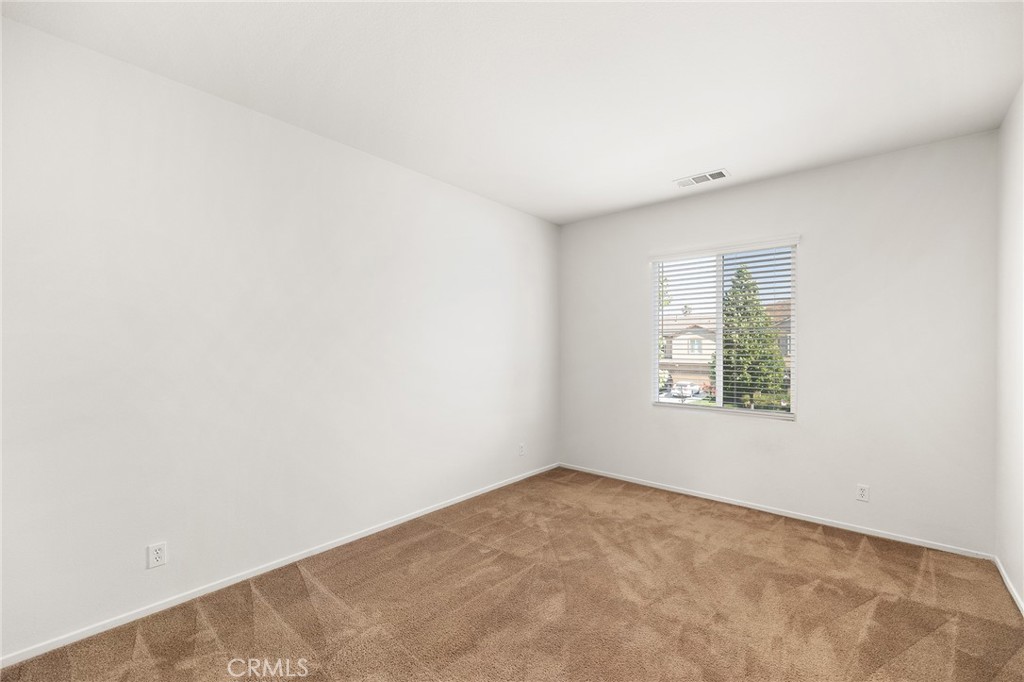 12047 Dewar Drive Riverside, CA 92505 - Photo 25 of 40 an empty room with windows