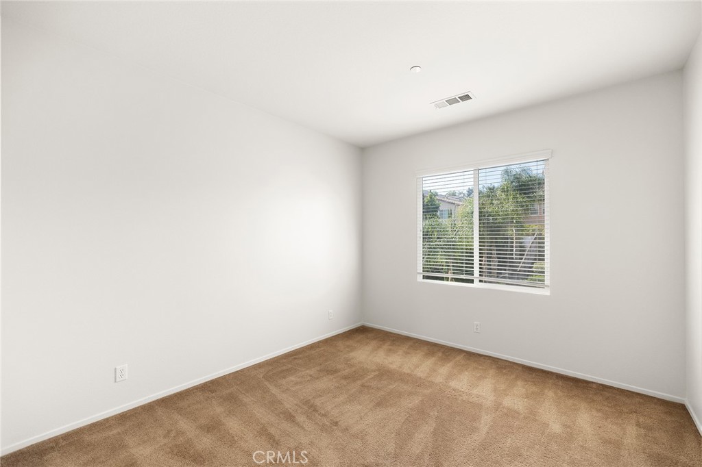 12047 Dewar Drive Riverside, CA 92505 - Photo 27 of 40 an empty room with windows