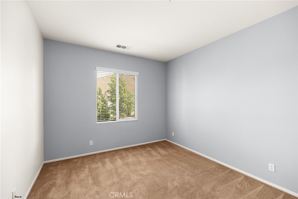 12047 Dewar Drive Riverside, CA 92505 - Photo 28 of 40 an empty room with a window
