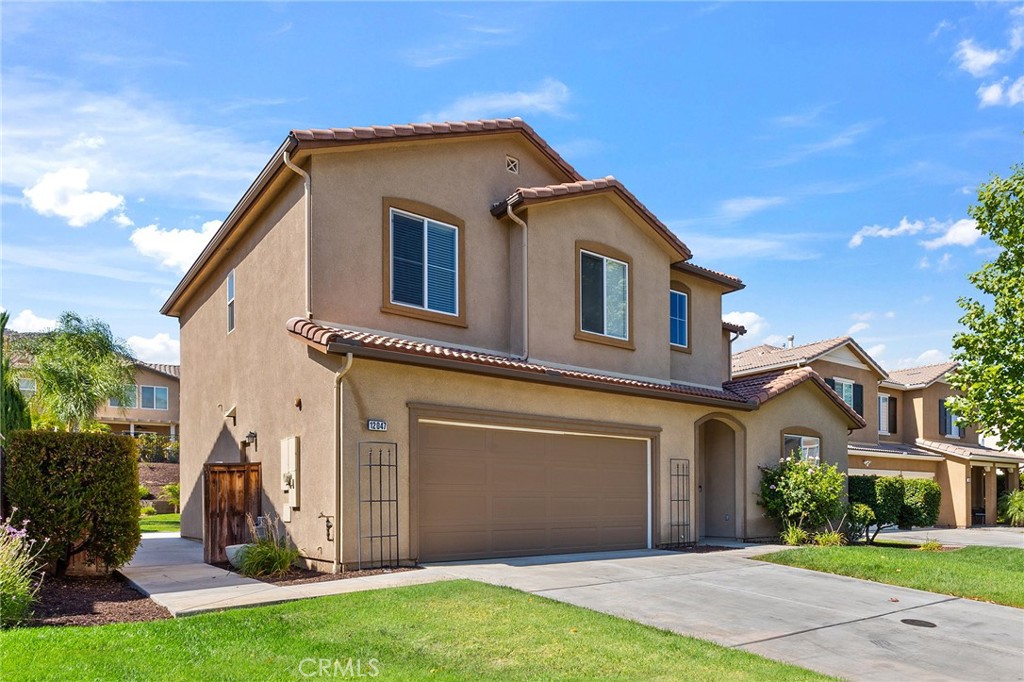 12047 Dewar Drive Riverside, CA 92505 - Photo 3 of 40 a front view of a house with a yard