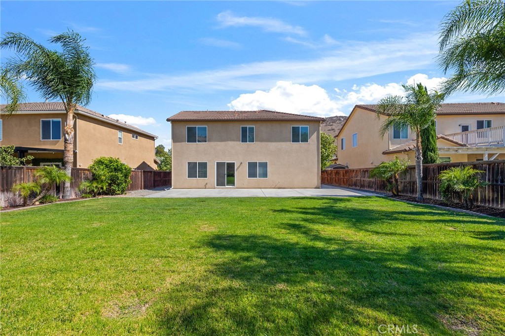 12047 Dewar Drive Riverside, CA 92505 - Photo 33 of 40 a view of a yard in front of a house with plants and large tree