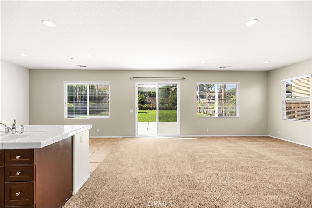 12047 Dewar Drive Riverside, CA 92505 - Photo 9 of 40 a view of an empty room with a window