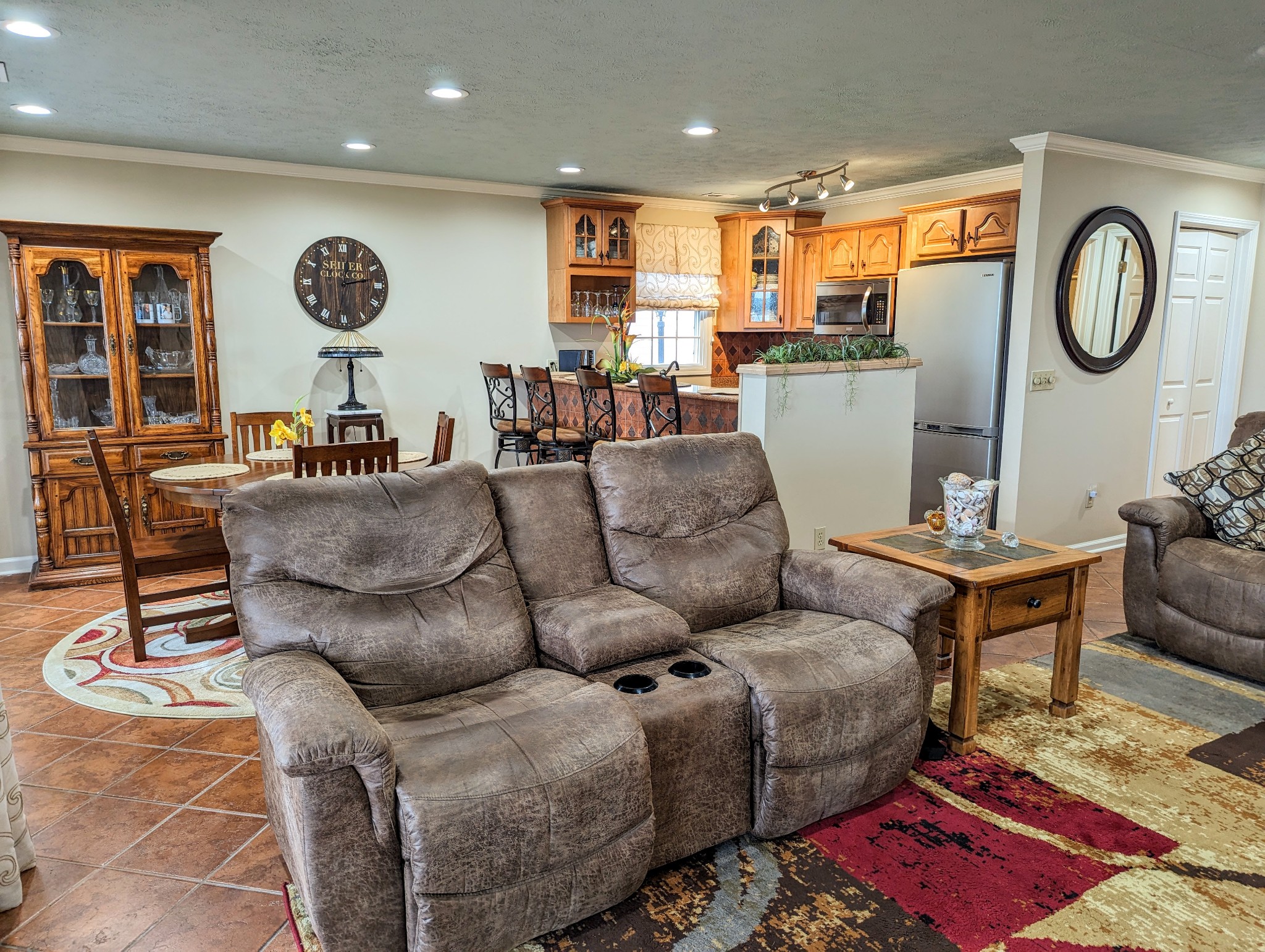 226 Pleasant Place, Unit B2 Springville, TN 38256 - Photo 13 of 43 a living room with furniture a clock on wall and a large window