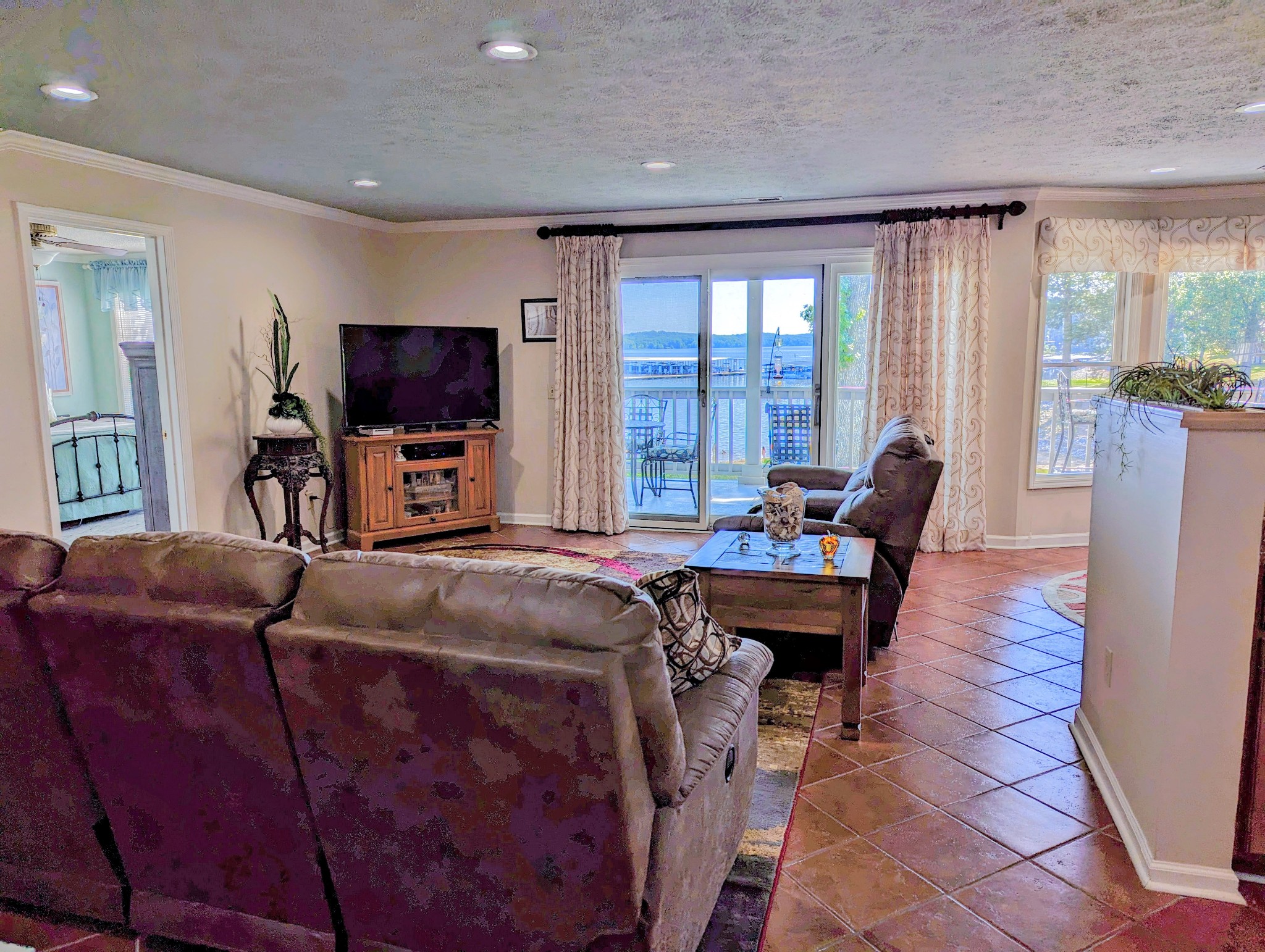 226 Pleasant Place, Unit B2 Springville, TN 38256 - Photo 23 of 43 a living room with furniture and a flat screen tv