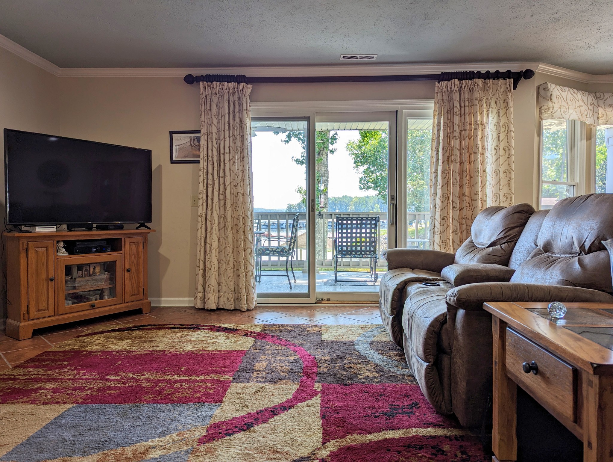 226 Pleasant Place, Unit B2 Springville, TN 38256 - Photo 31 of 43 a living room with furniture and a flat screen tv