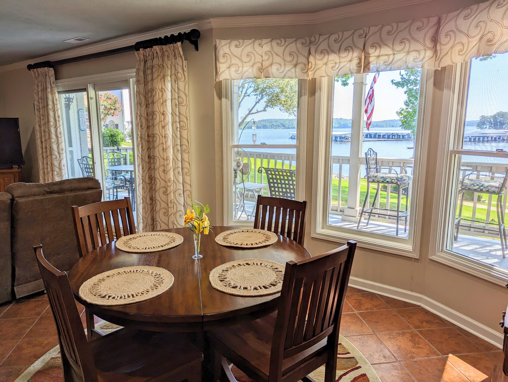 226 Pleasant Place, Unit B2 Springville, TN 38256 - Photo 32 of 43 a view of a dining room with furniture large windows and wooden floor