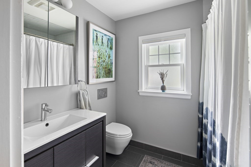60 Rice Road Wayland, MA 01778 - Photo 13 of 26 a bathroom with a sink toilet a window and shower
