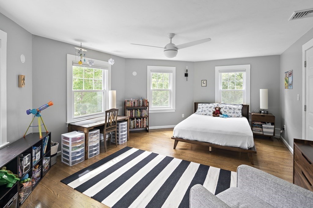 60 Rice Road Wayland, MA 01778 - Photo 15 of 26 a bedroom with two beds and a chandelier