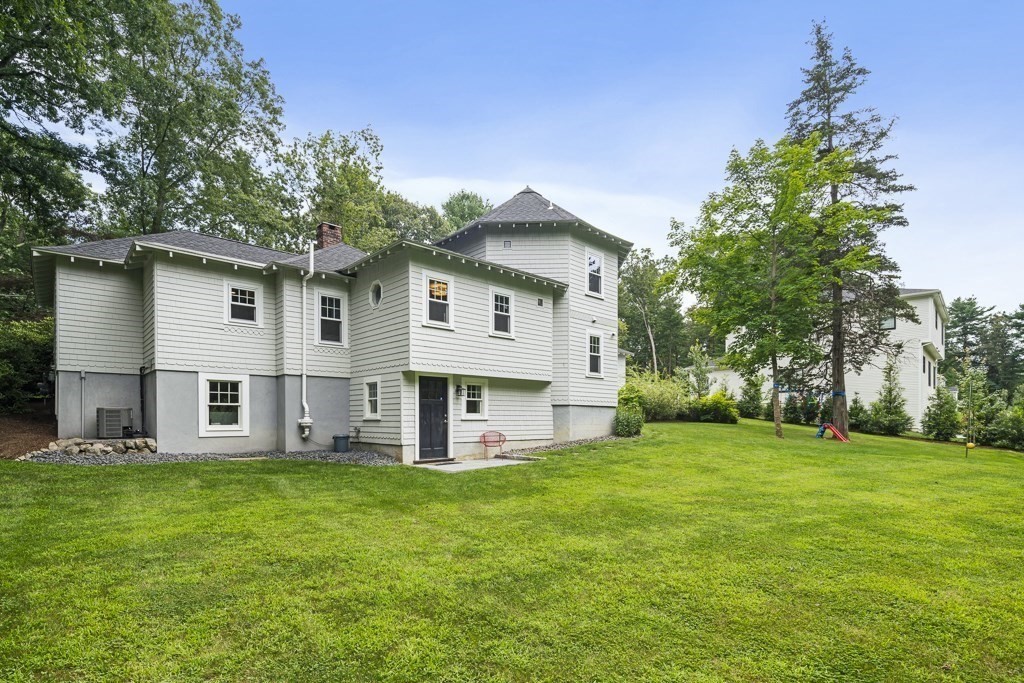 60 Rice Road Wayland, MA 01778 - Photo 22 of 26 a front view of house with yard and green space
