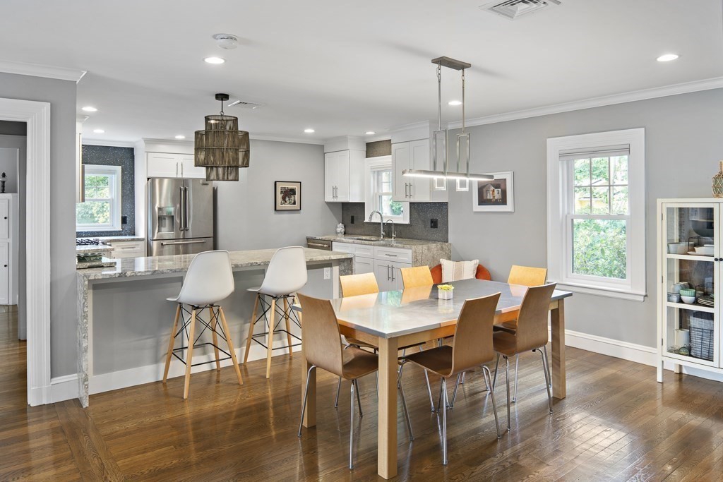 60 Rice Road Wayland, MA 01778 - Photo 5 of 26 a view of a dining room with furniture and wooden floor