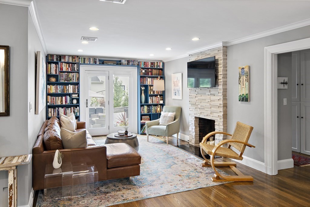60 Rice Road Wayland, MA 01778 - Photo 6 of 26 a living room with furniture hard wood floor and a fireplace
