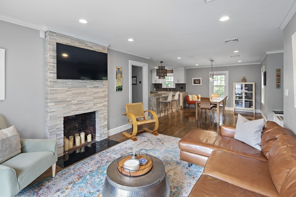 60 Rice Road Wayland, MA 01778 - Photo 7 of 26 a living room with furniture fireplace and flat screen tv