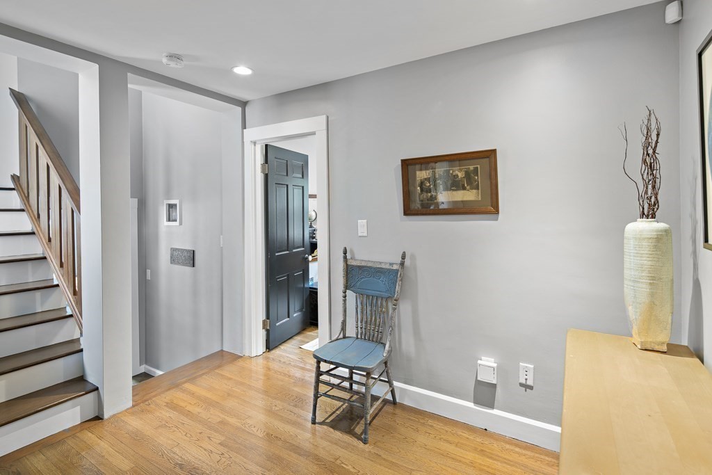 60 Rice Road Wayland, MA 01778 - Photo 9 of 26 a view of a hallway with wooden floor and furniture