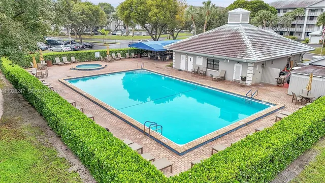 a view of a patio with a table and chairs