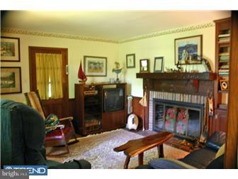1 Rabbit Run Road Malvern, PA 19355 - Photo 9 of 10 a living room with furniture and a fireplace