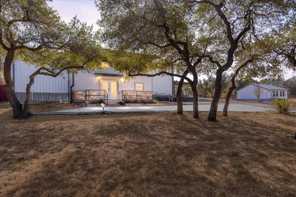a view of a yard with trees