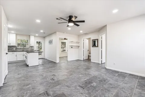 a view of empty room with windows