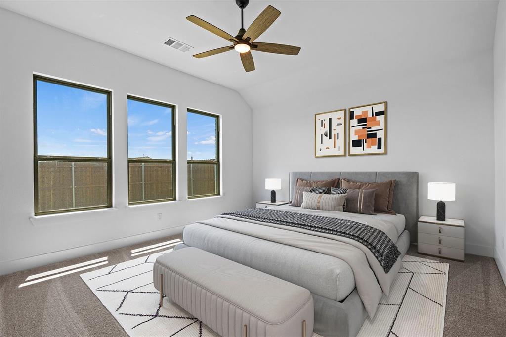 1792 Monarch Way Oak Point, TX 75068 - Photo 7 of 26 a bedroom with a bed and a large window