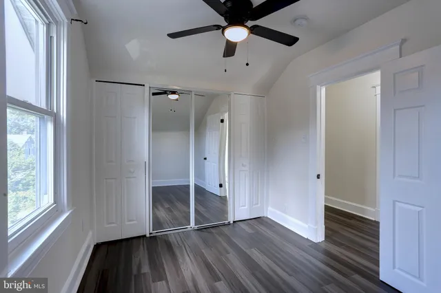 a bathroom with sink toilet and window