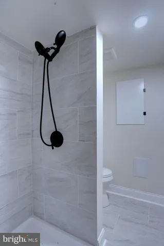a view of a room with wooden floors and led lights
