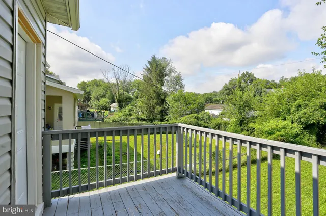 a view of wooden fence and trees