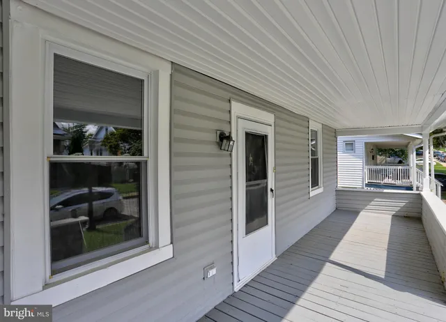 a view of living room with furniture and wooden floor