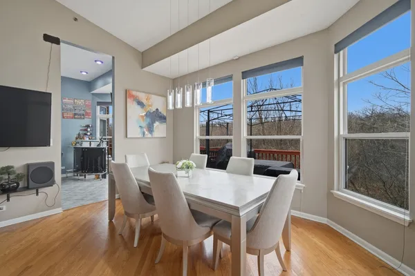 a view of a dining room with furniture window and wooden floor