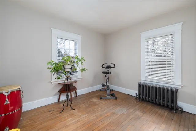 a view of a livingroom with furniture and a window
