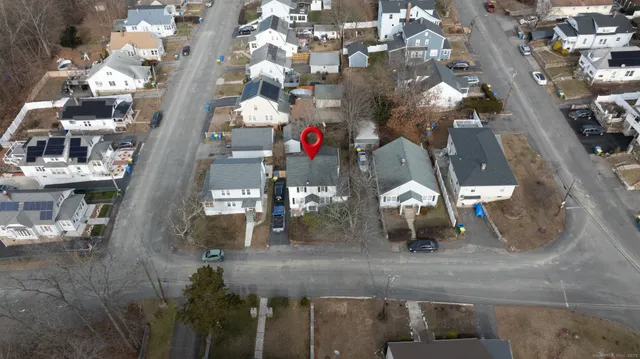 an aerial view of multi story residential apartment building with yard