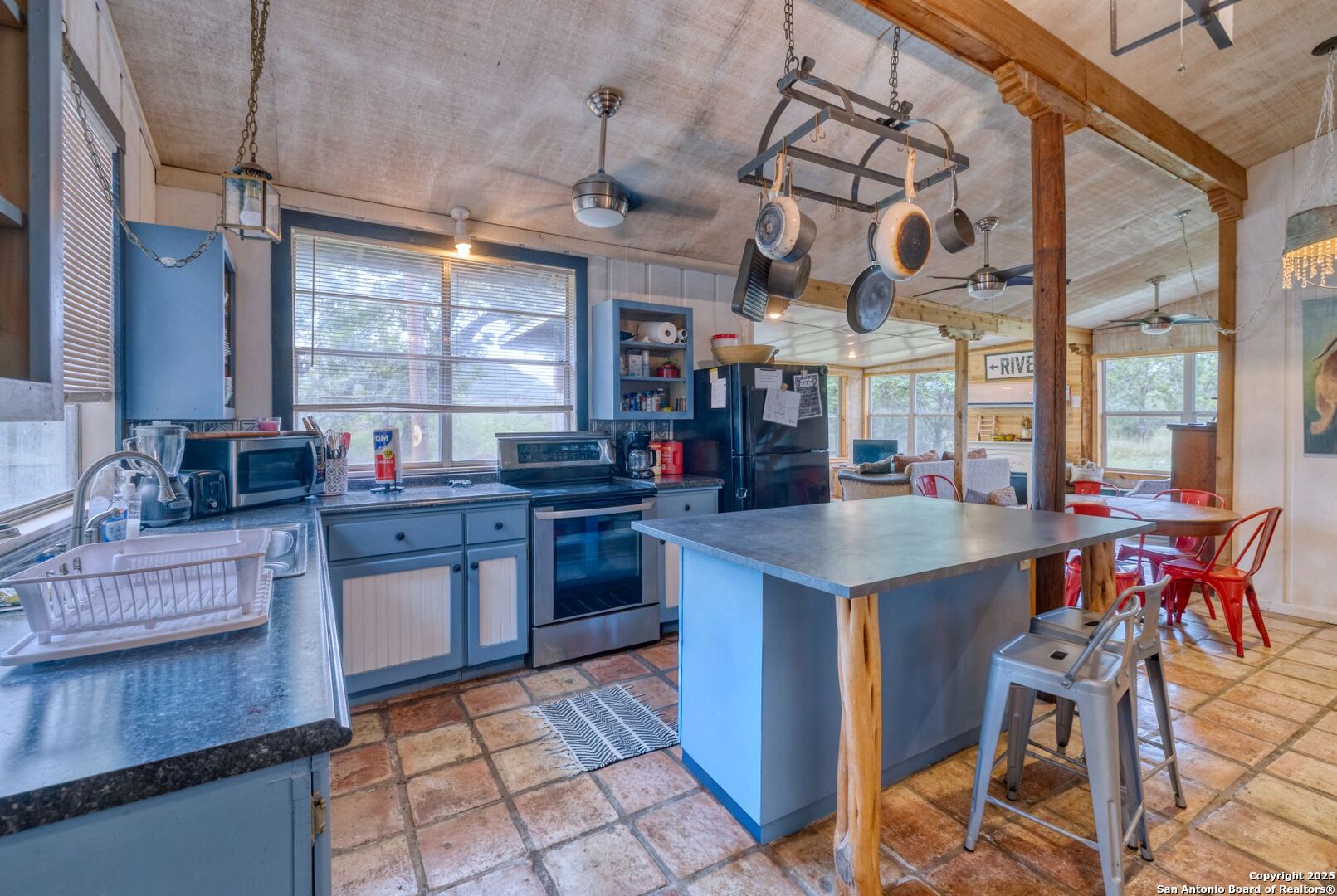 394 Squirrel Bend Uvalde, TX 78801 - Photo 14 of 80 a kitchen with stainless steel appliances granite countertop a sink and cabinets