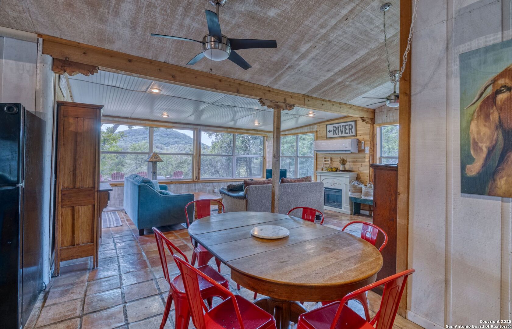 394 Squirrel Bend Uvalde, TX 78801 - Photo 17 of 80 a view of a dining room with furniture window and wooden floor