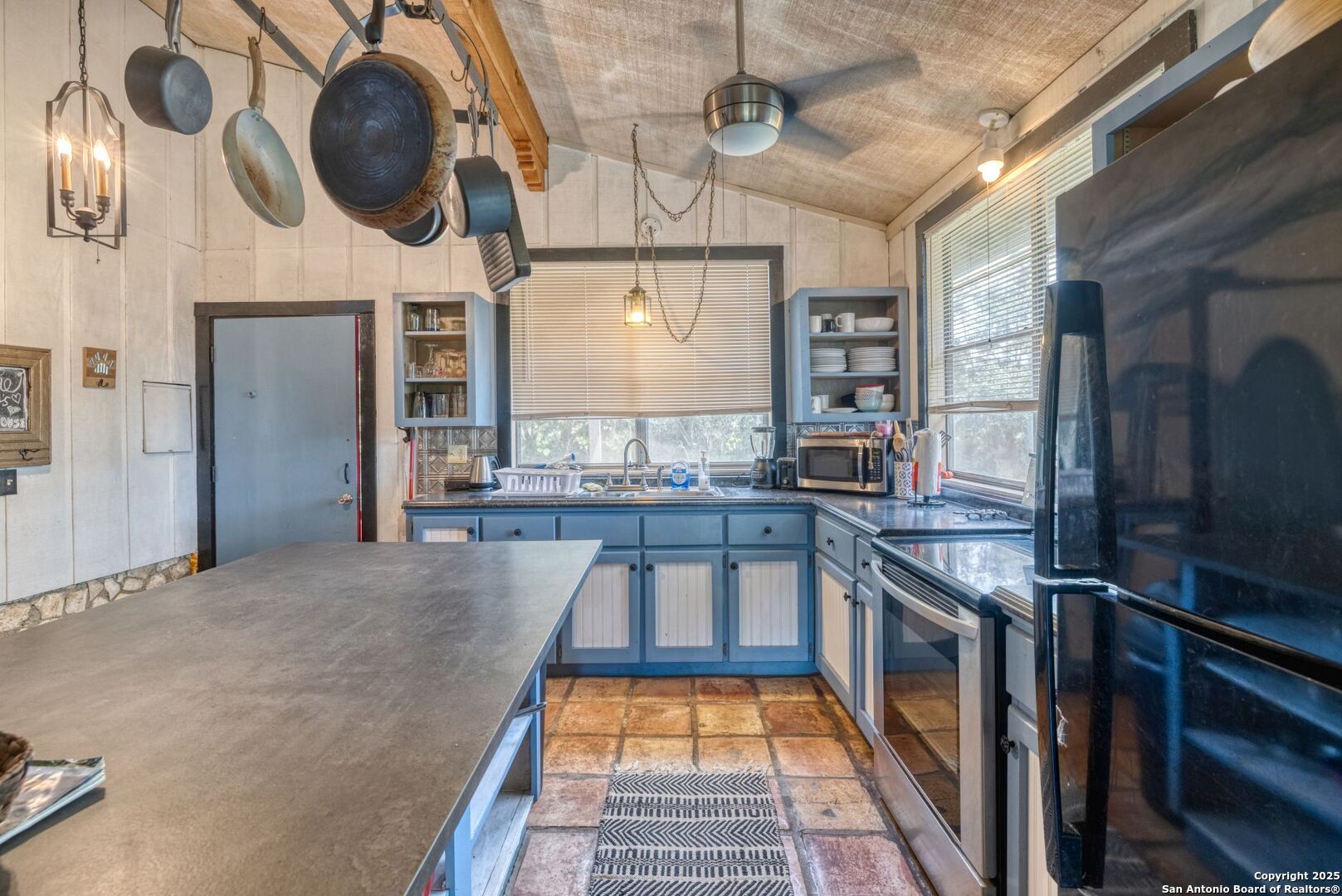 394 Squirrel Bend Uvalde, TX 78801 - Photo 18 of 80 a kitchen with stainless steel appliances granite countertop a stove and cabinets