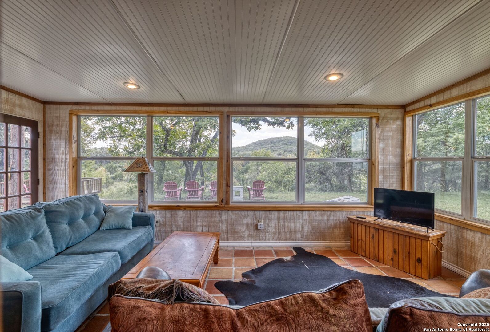 394 Squirrel Bend Uvalde, TX 78801 - Photo 20 of 80 a living room with furniture and a flat screen tv