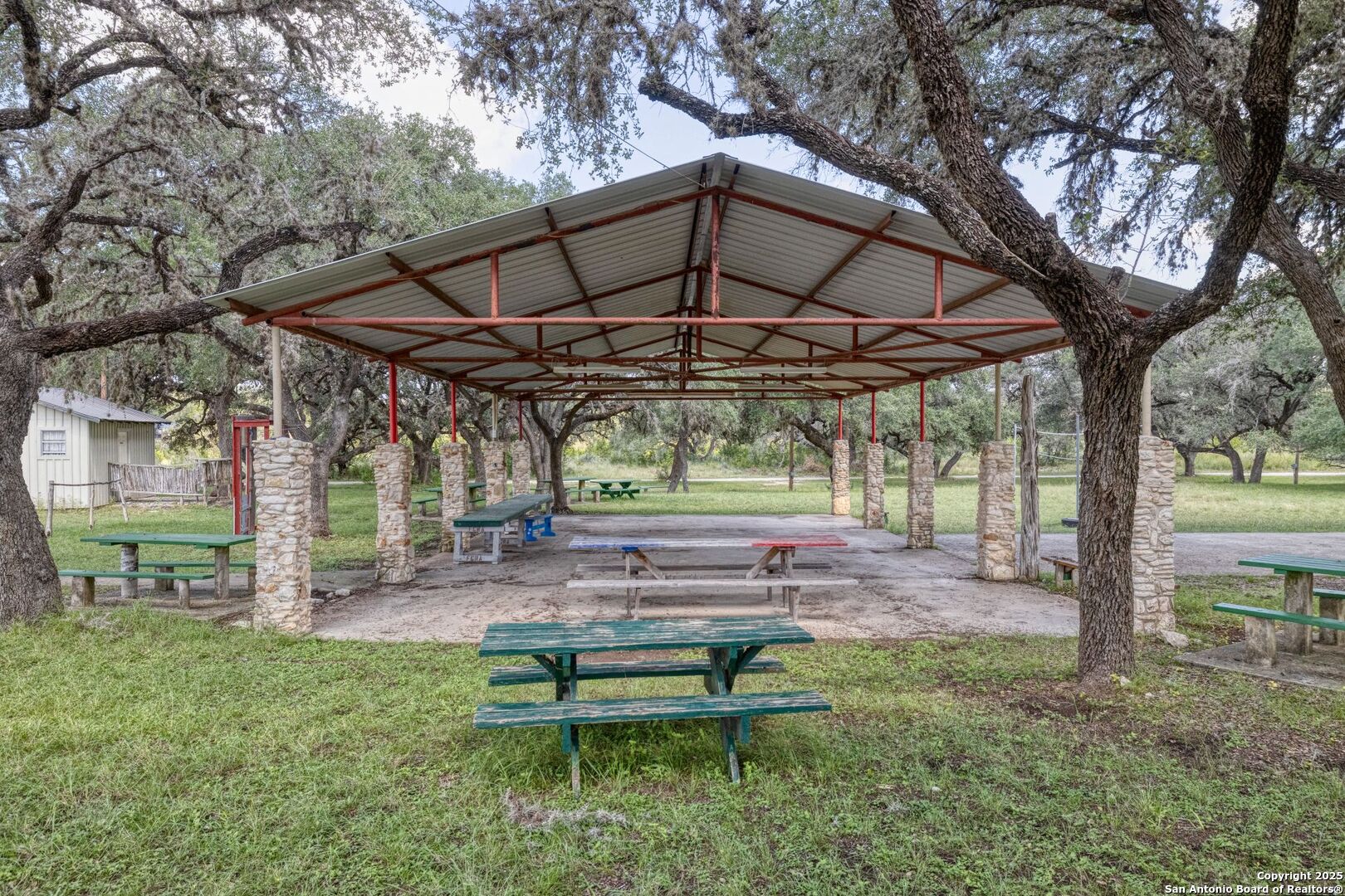 394 Squirrel Bend Uvalde, TX 78801 - Photo 42 of 80 a backyard of a house with table and chairs